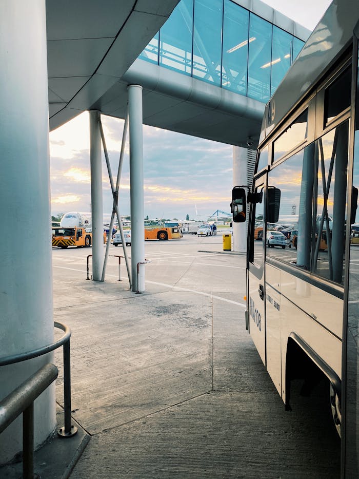 Contemporary airport view with buses and planes in Bucharest, Romania.